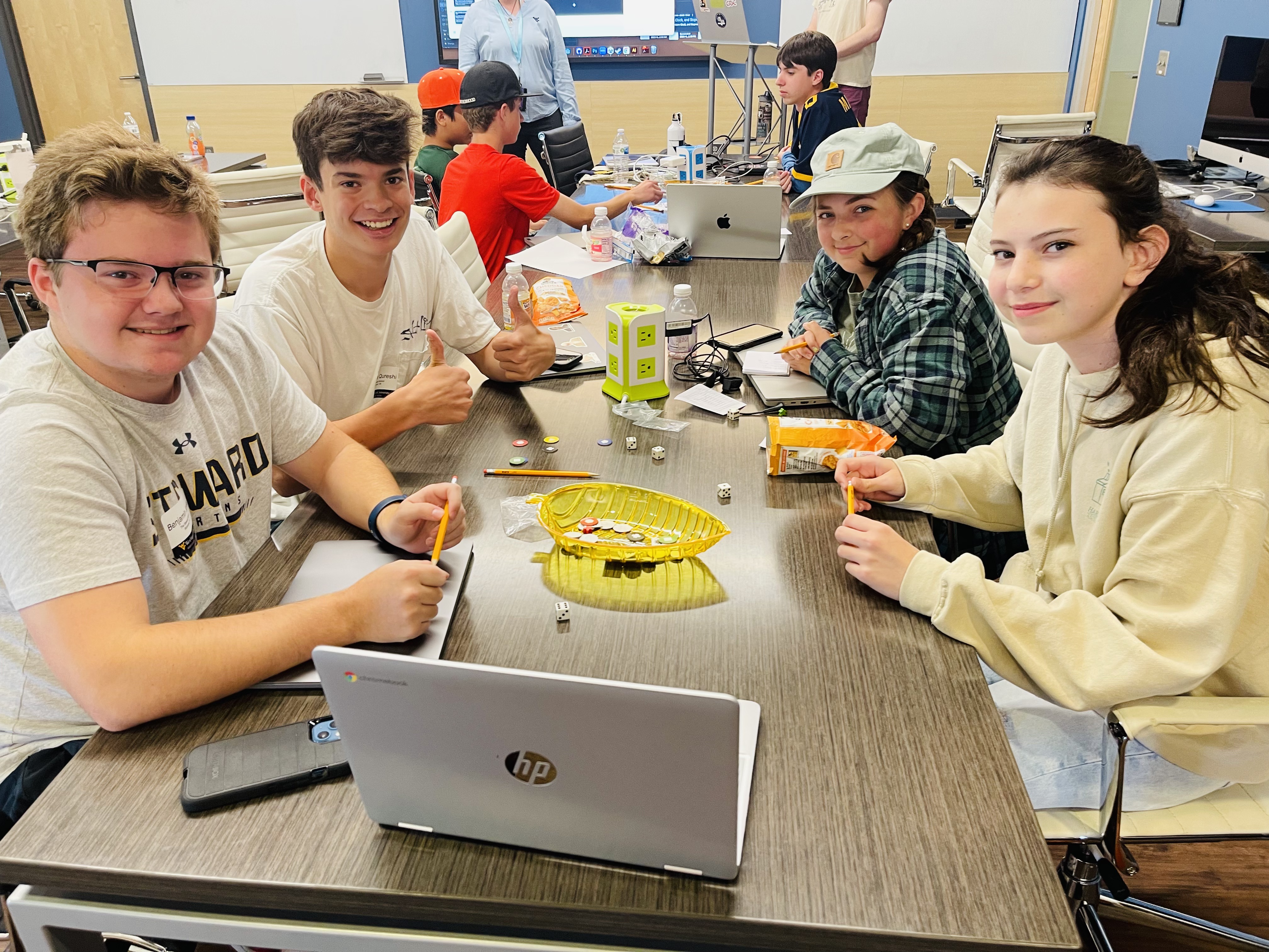 Students solving game problem at Media Innovation Center