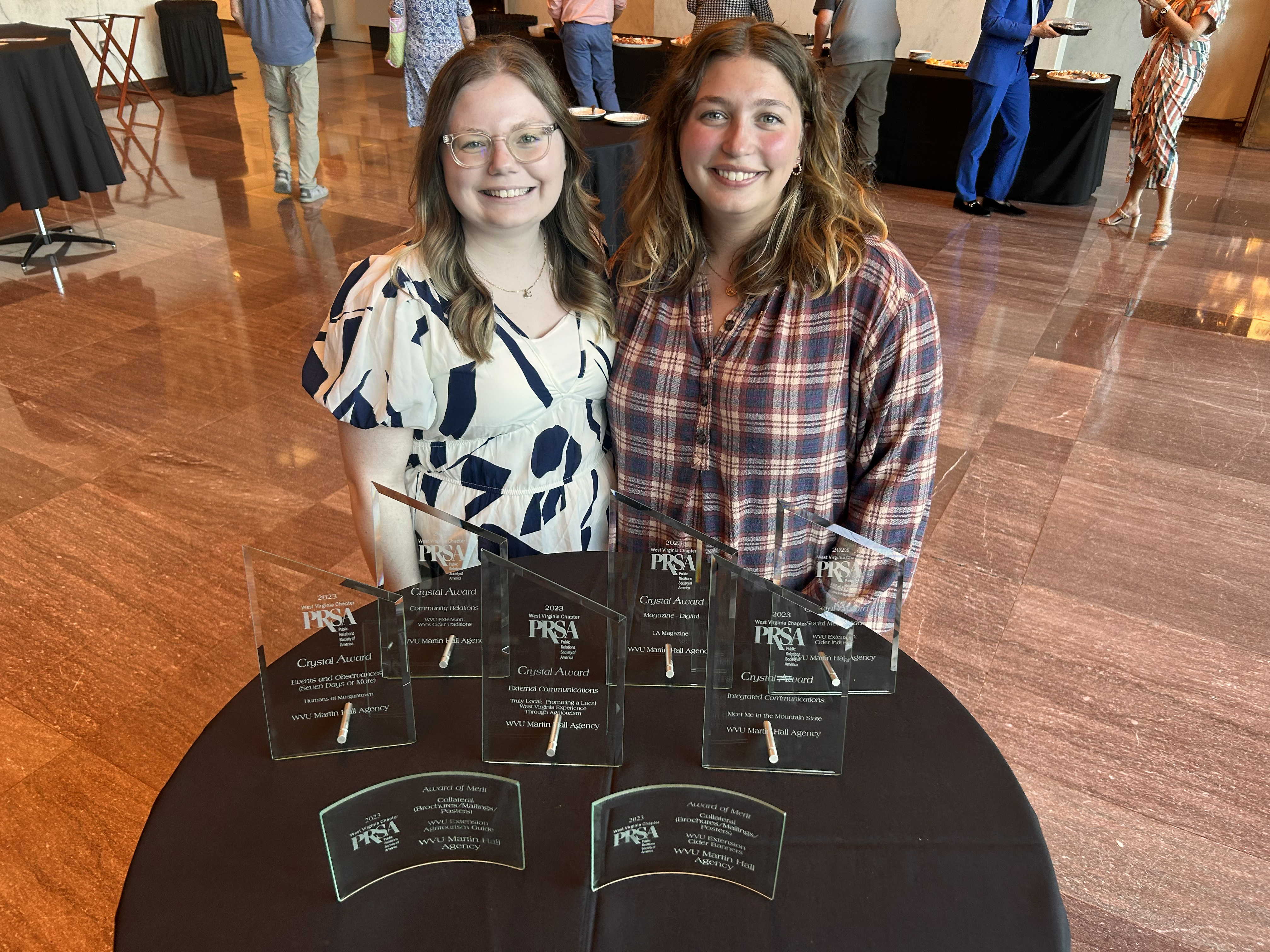 Cheyenne Oakes and Emma Magruder with PRSA Crystal Awards
