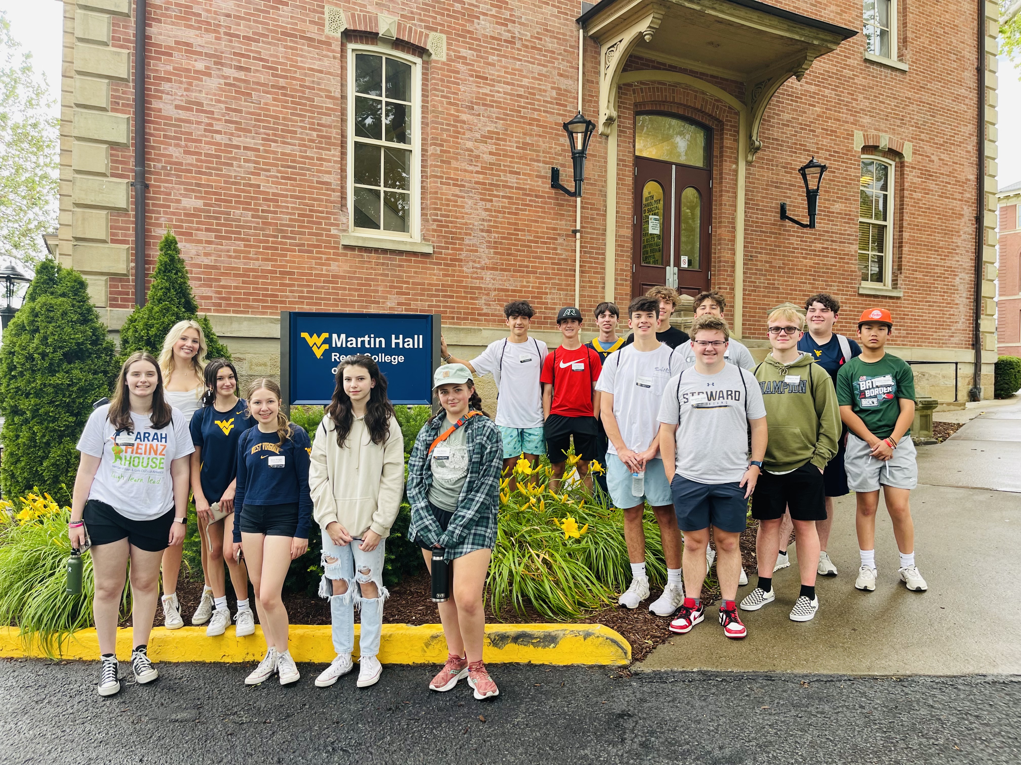 Students pose in front of Martin Hall on WVU's Downtown campus